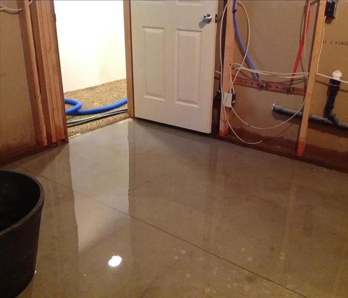 Standing water in a small room.